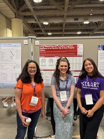 Academic and students at poster